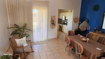 step into your sanctuary open living dining combo with easy access to kitchen and terrace
